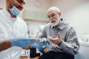 dental implants vs dentures which is better warner brisbane