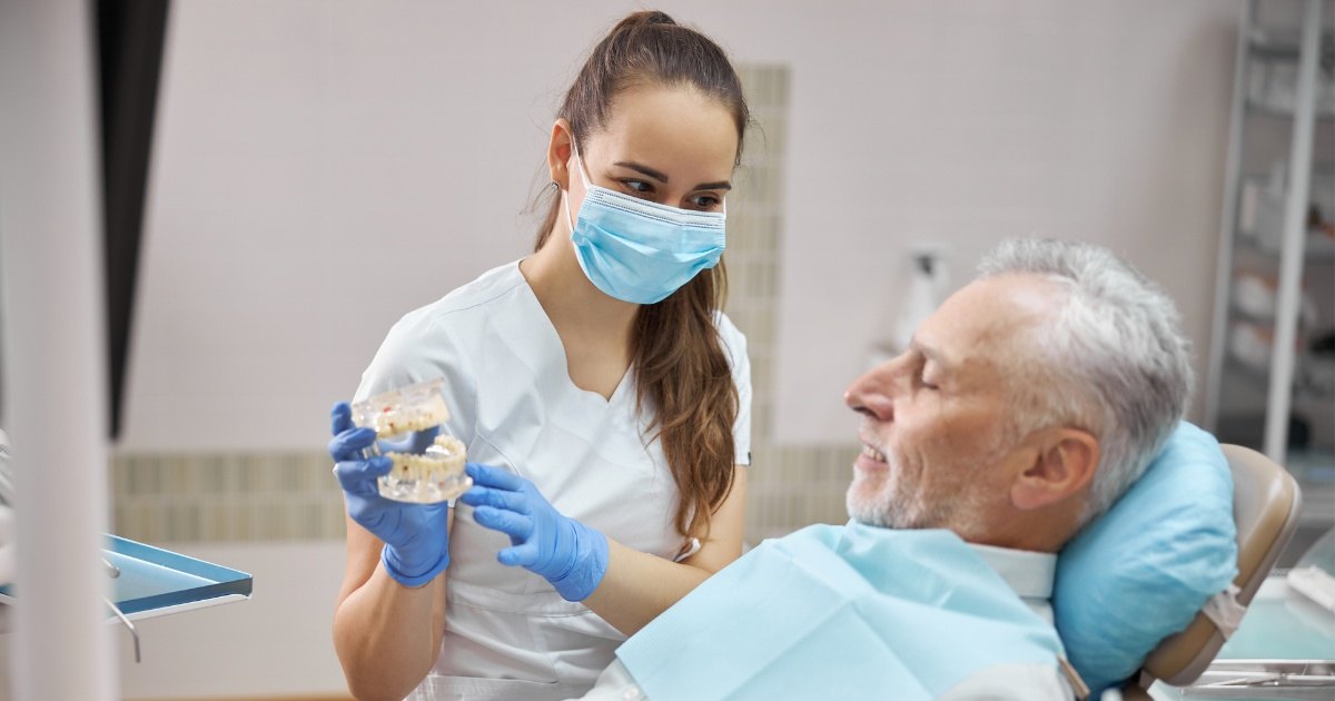 a doctor explaining dental implants to patient